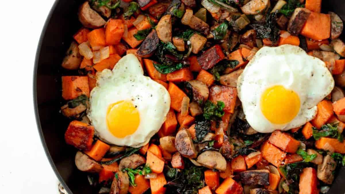 Sweet potato sausage hash topped with an egg.
