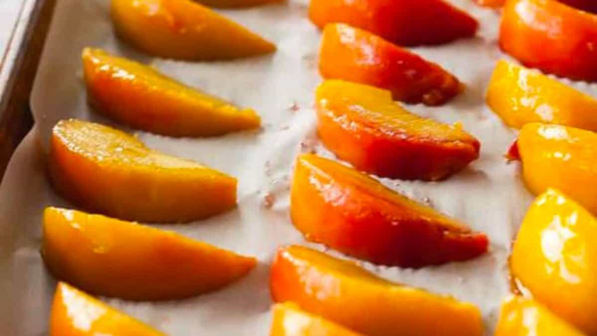 Peaches on a sheet pan.