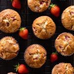 Strawberry muffins in a muffin tin.