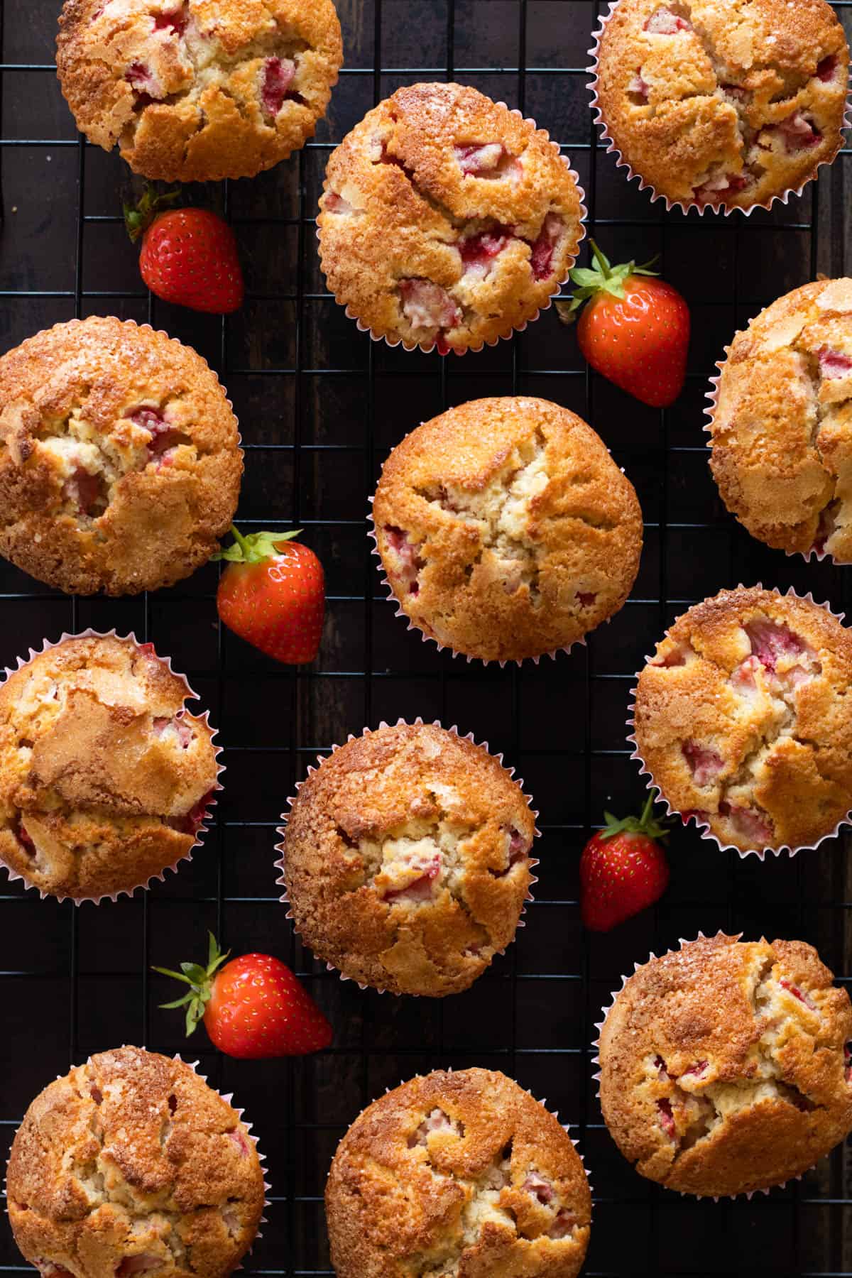 Strawberry muffins in a muffin tin.