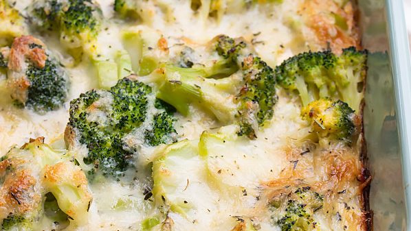 A casserole full of broccoli and cheese.