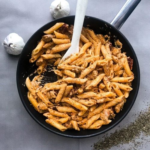 A pan full of sundried tomato chicken pasta.