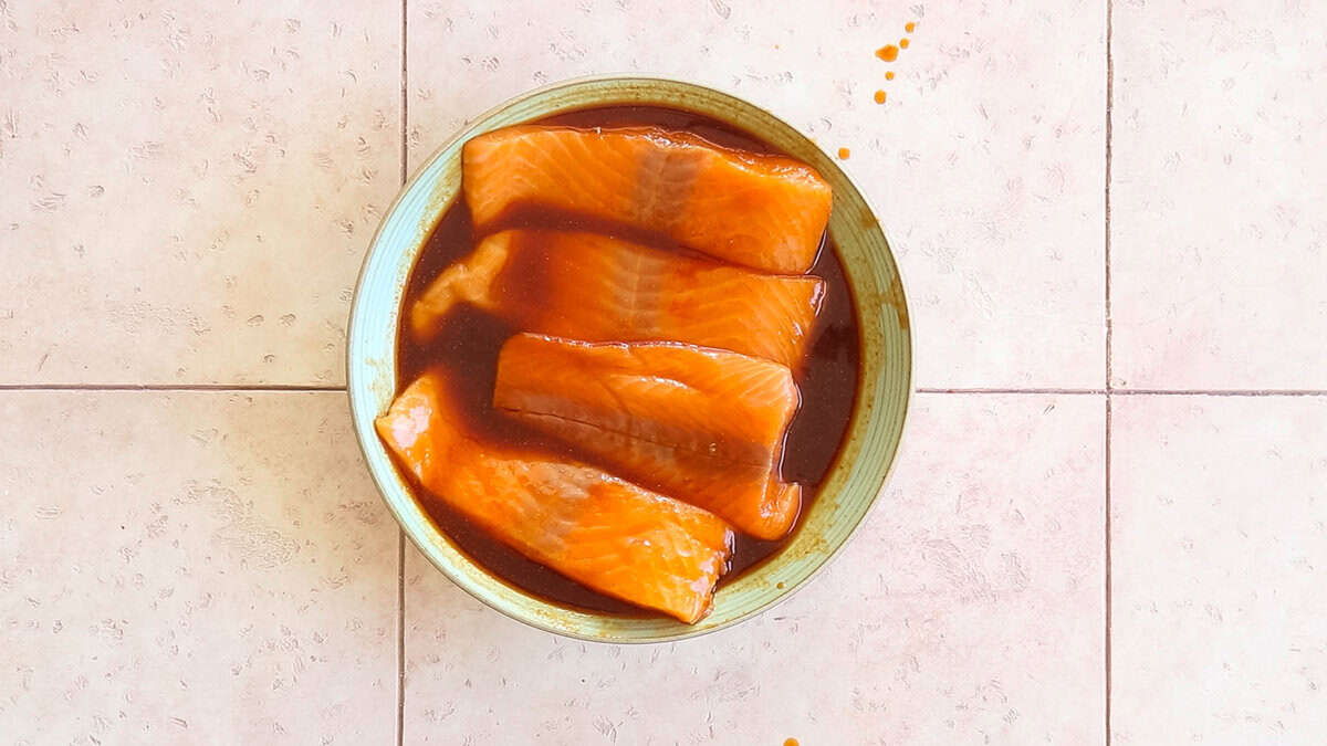 Marinating firecracker salmon.