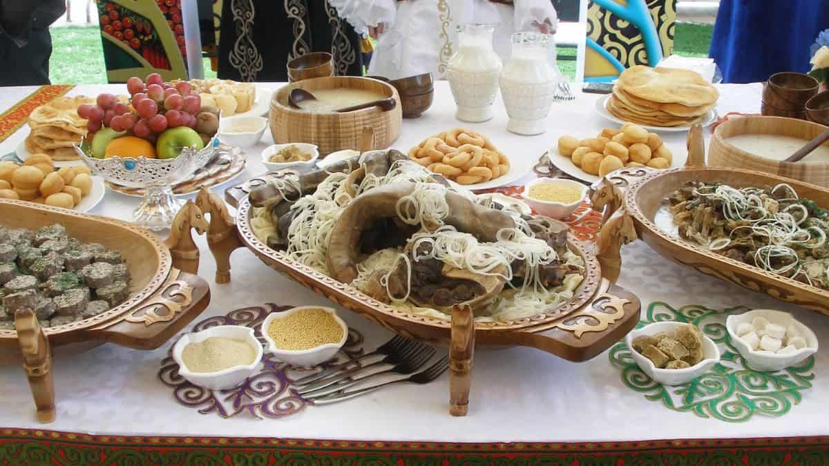 A table full of traditional Kazakhstan food dishes.