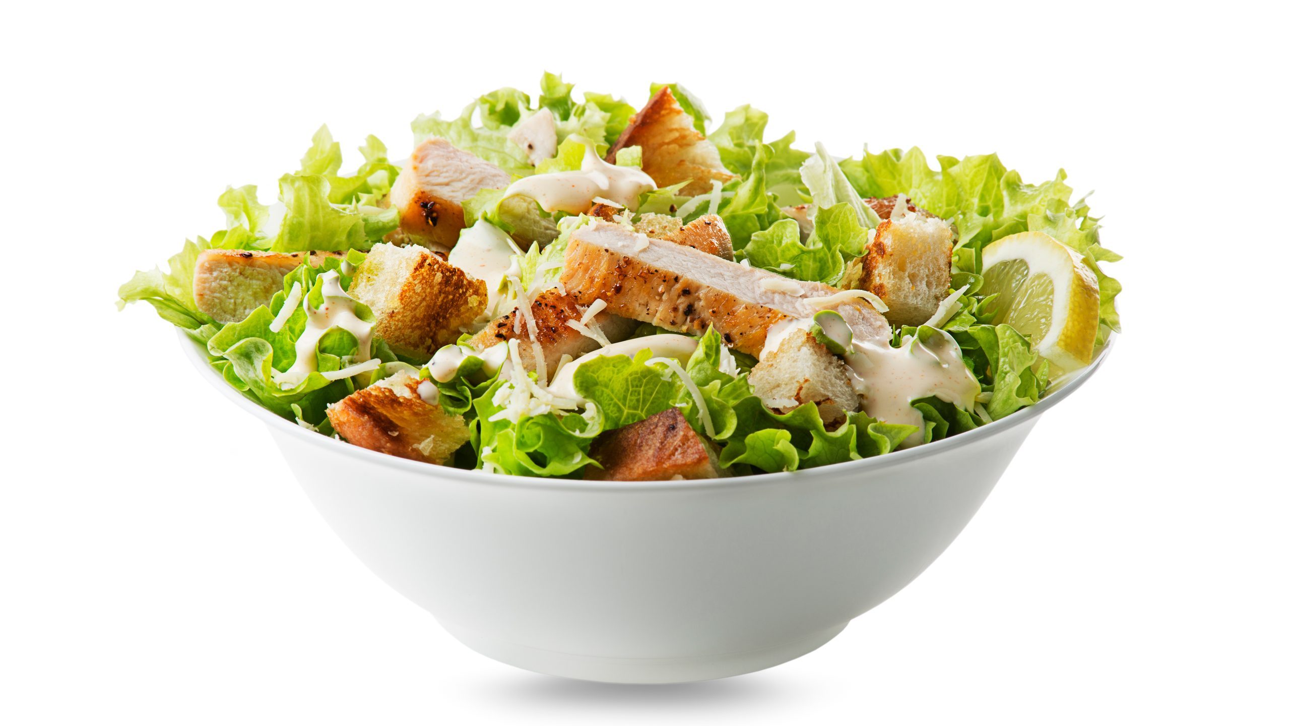 A bowl of Caesar salad.