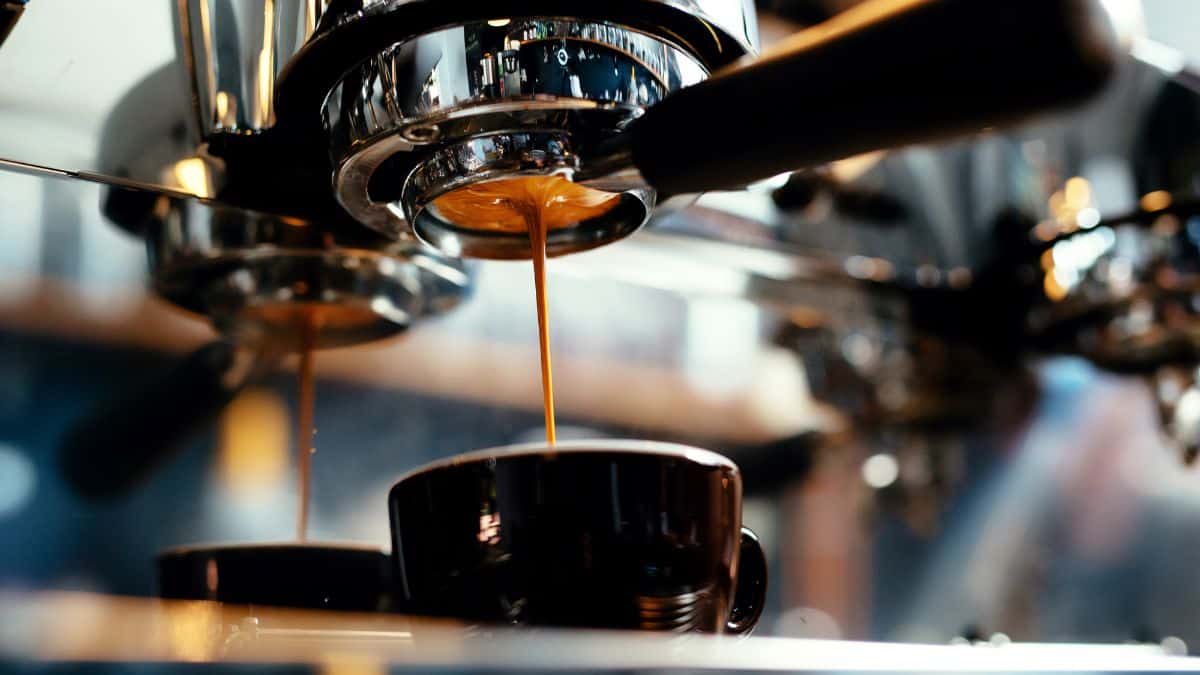 An espresso being made into a cup.