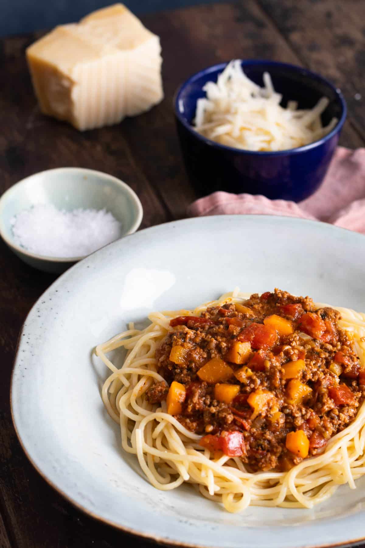 A bowl of instant pot bolognese served over pasta.