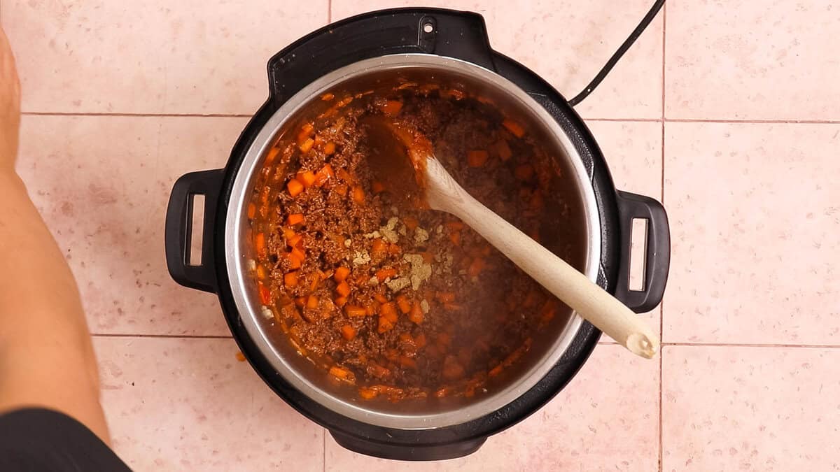 Sauteing veggies and ground beef in instant pot for bolognese.