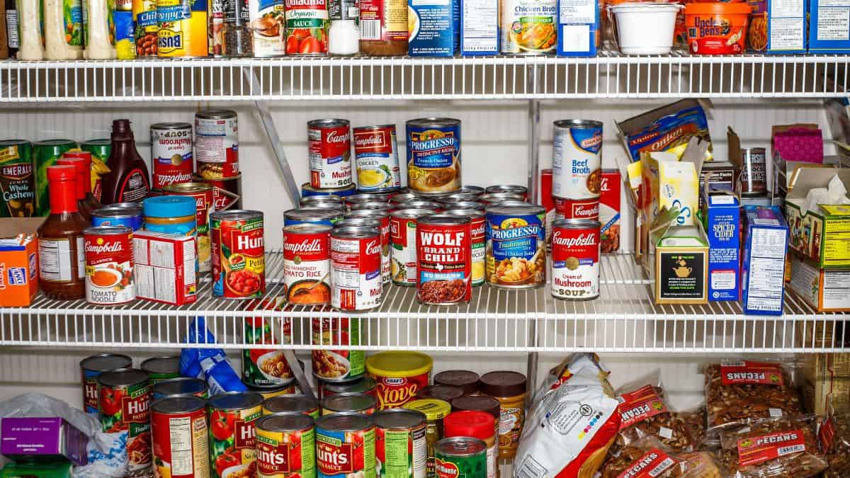 A pantry stocked with canned food.