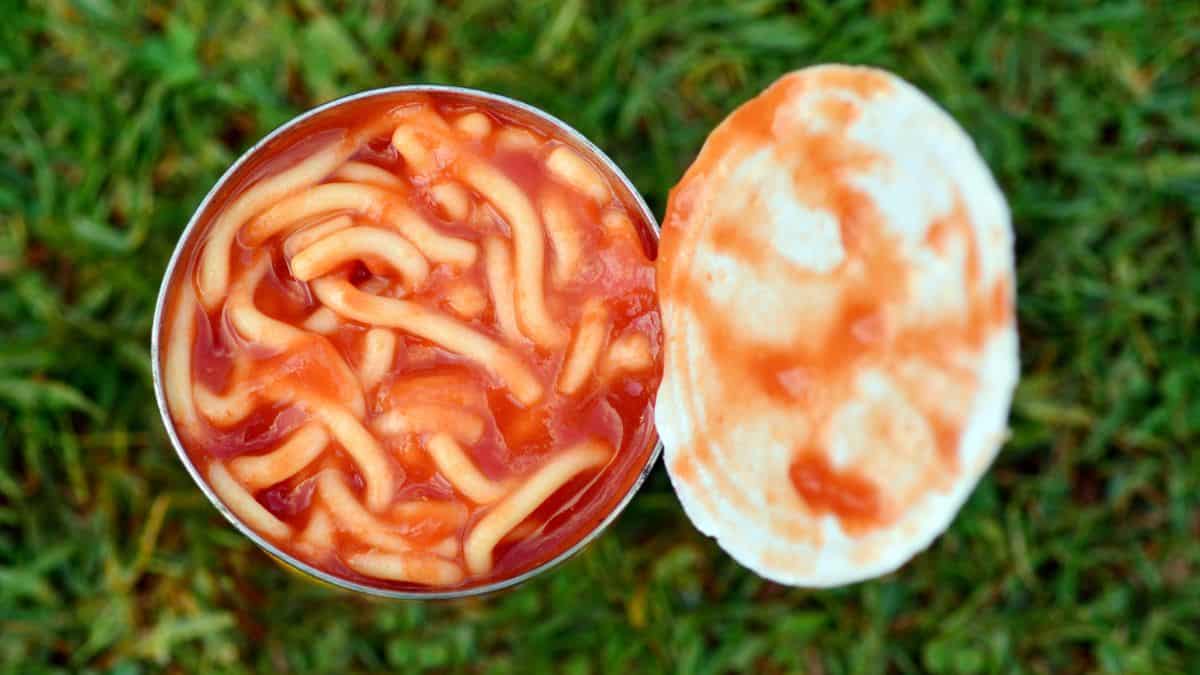 A can of spaghetti with tomato sauce.