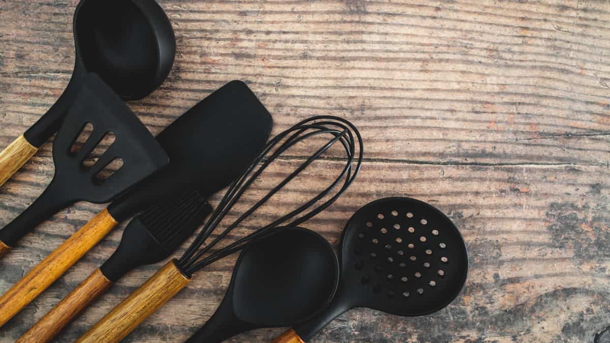 A set of matching kitchen utensils.