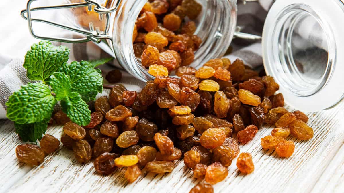 Raisins spilling out of a jar.