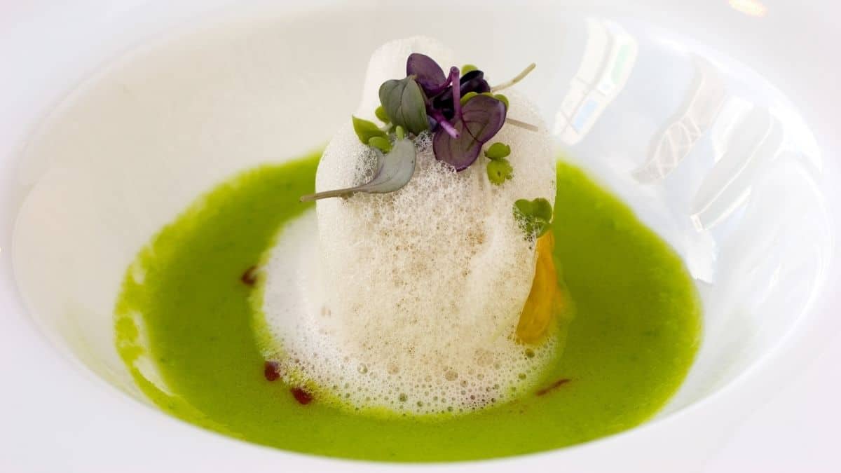 A fancy dish topped with foam.