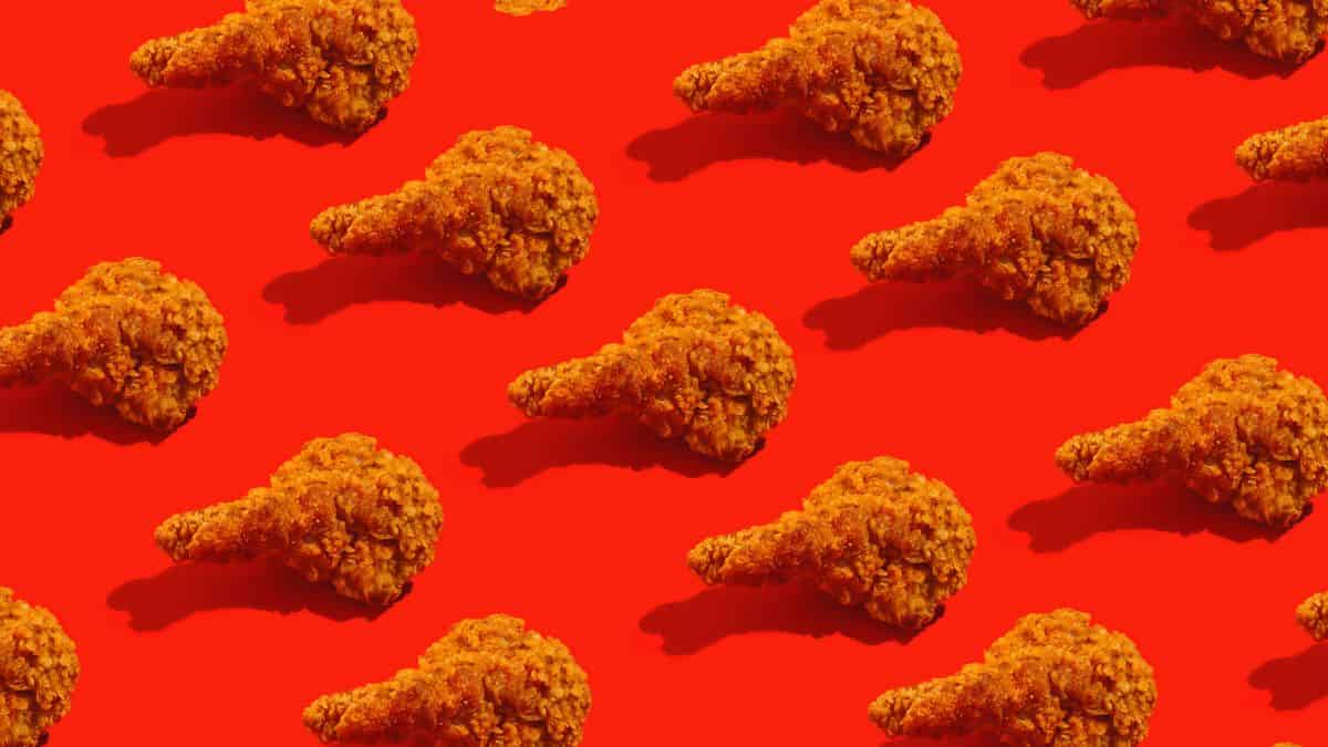 Fried chicken on a red background.