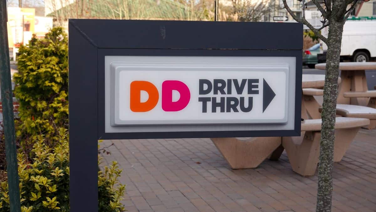 A sign for Dunkin' drive thru.