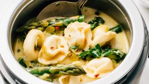 Tortellini soup in crockpot.