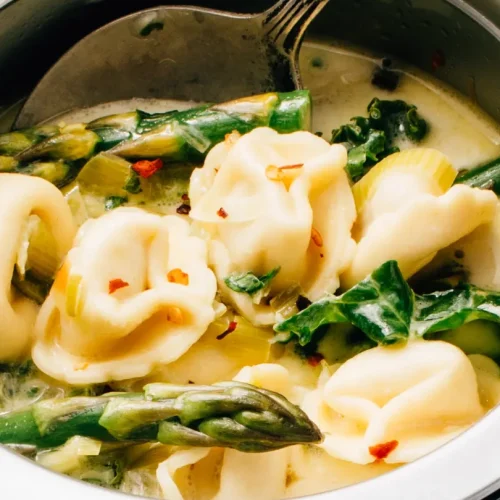 Tortellini soup in crockpot.