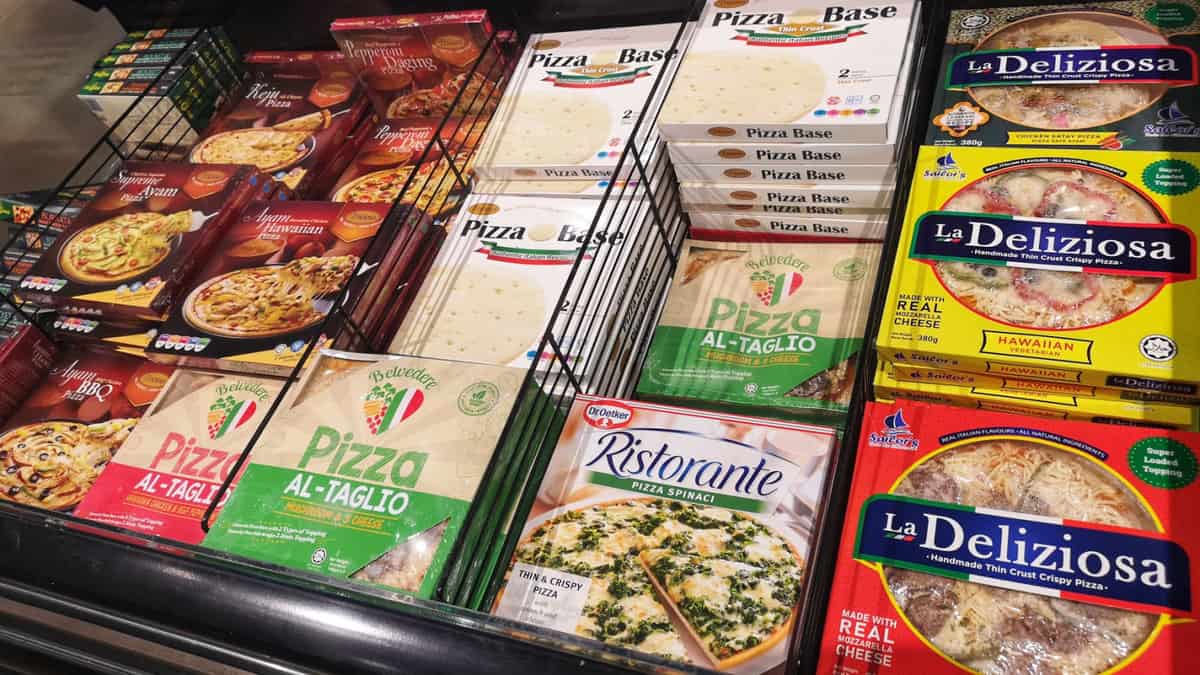 Frozen pizzas in a store.