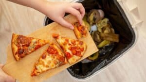 Throwing away food.