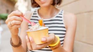A woman eating ice cream.