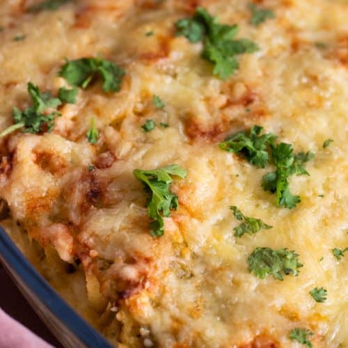 Chicken enchiladas with green sauce.