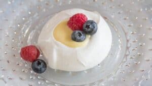 A lemon meringue nest with berries.