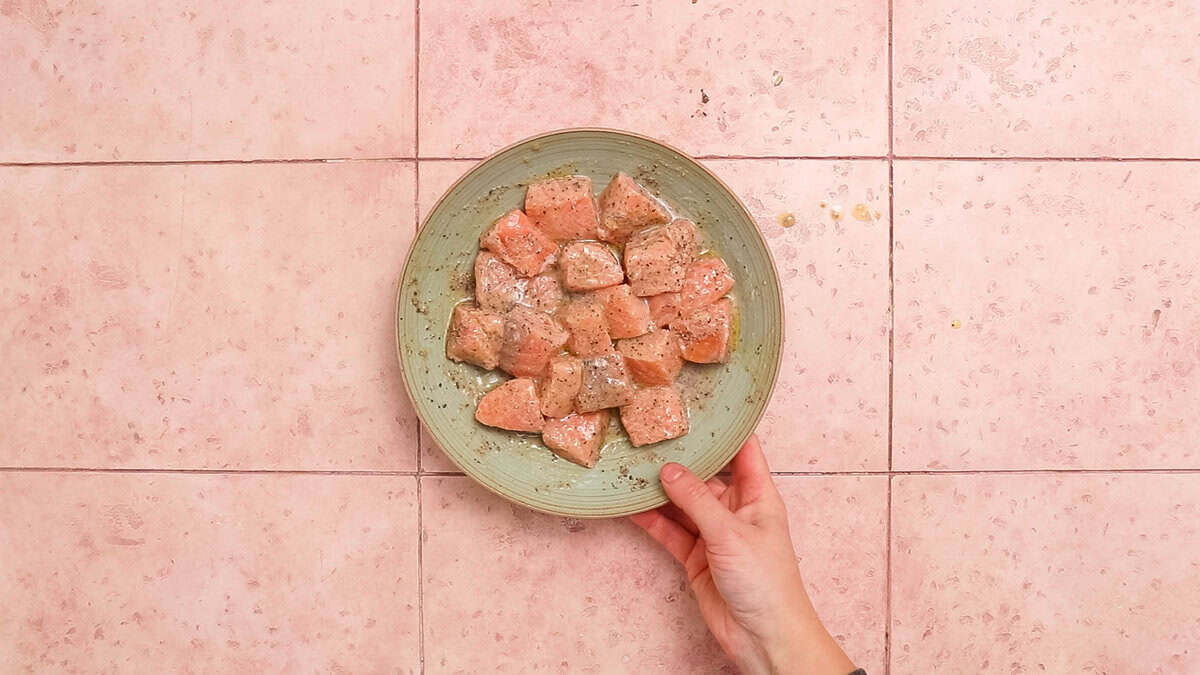 Salmon bites after seasoning and mixing with lemon juice.