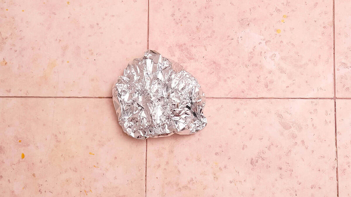 A foil package containing air fryer steak bites after cooking.