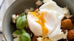 Poached egg on top of breakfast potatoes.
