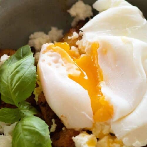 Poached egg on top of breakfast potatoes.