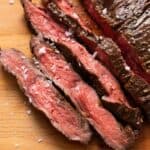 Sliced medium-rare air fryer skirt steak with a pink center.