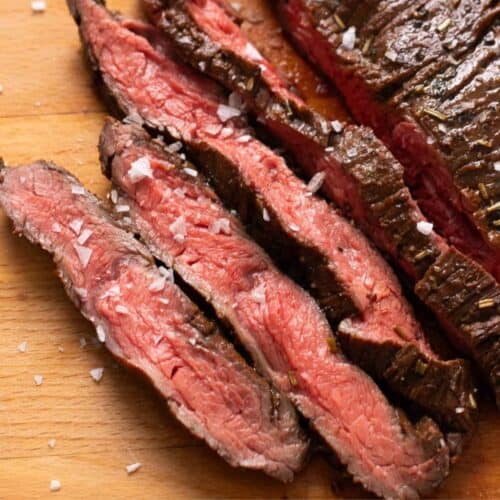 Sliced medium-rare air fryer skirt steak with a pink center.