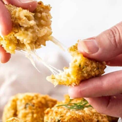 Pulling apart a cheesy risotto ball.