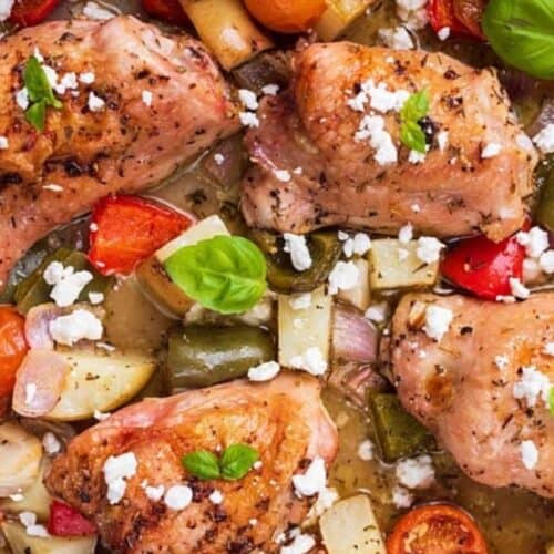 Chicken and veggies baked on a sheet pan.