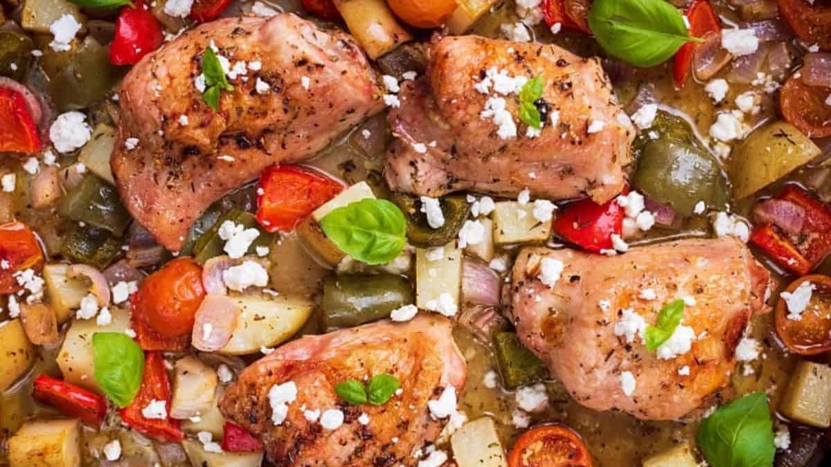 Chicken and veggies baked on a sheet pan.