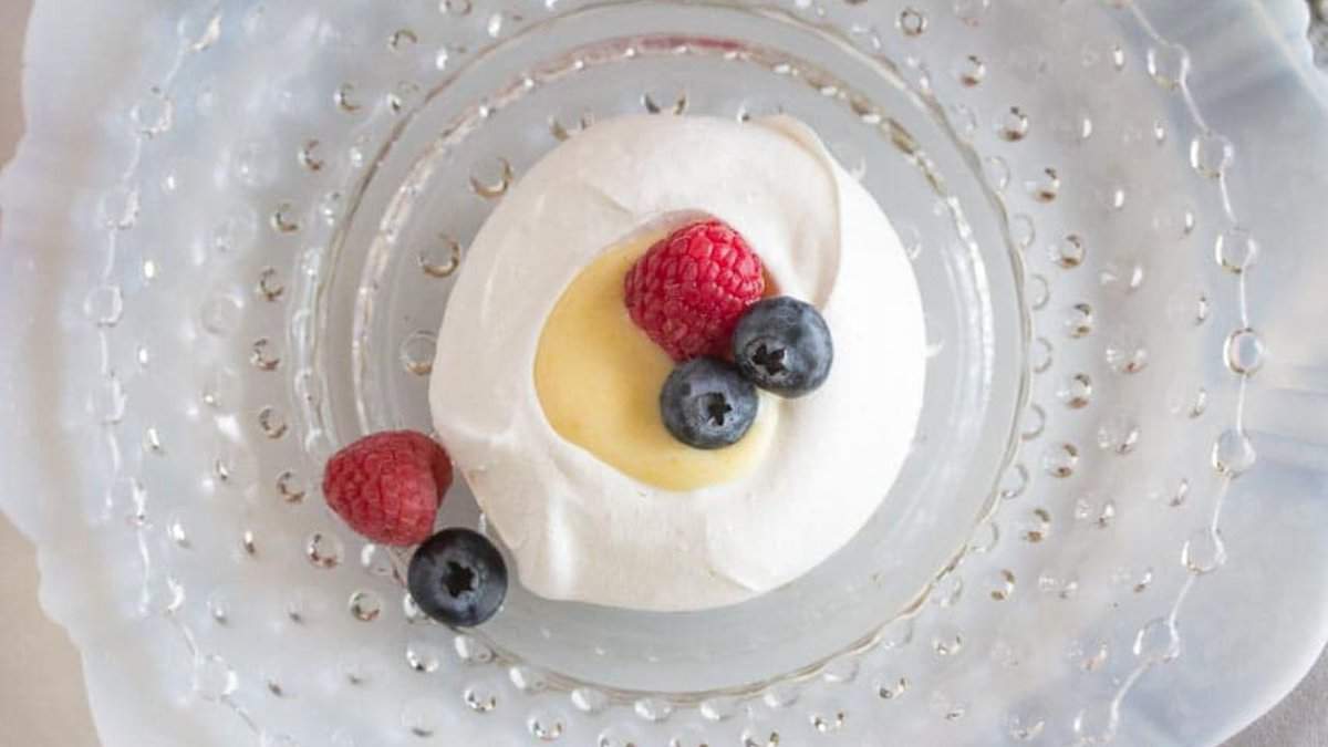 Meringue nests with lemon curd and berries.