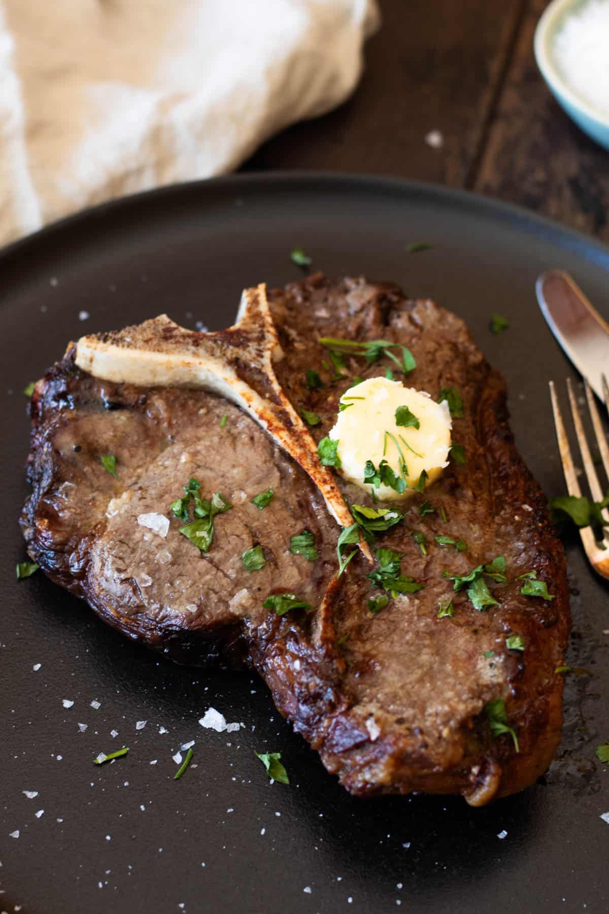 T-bone steak with garlic butter.