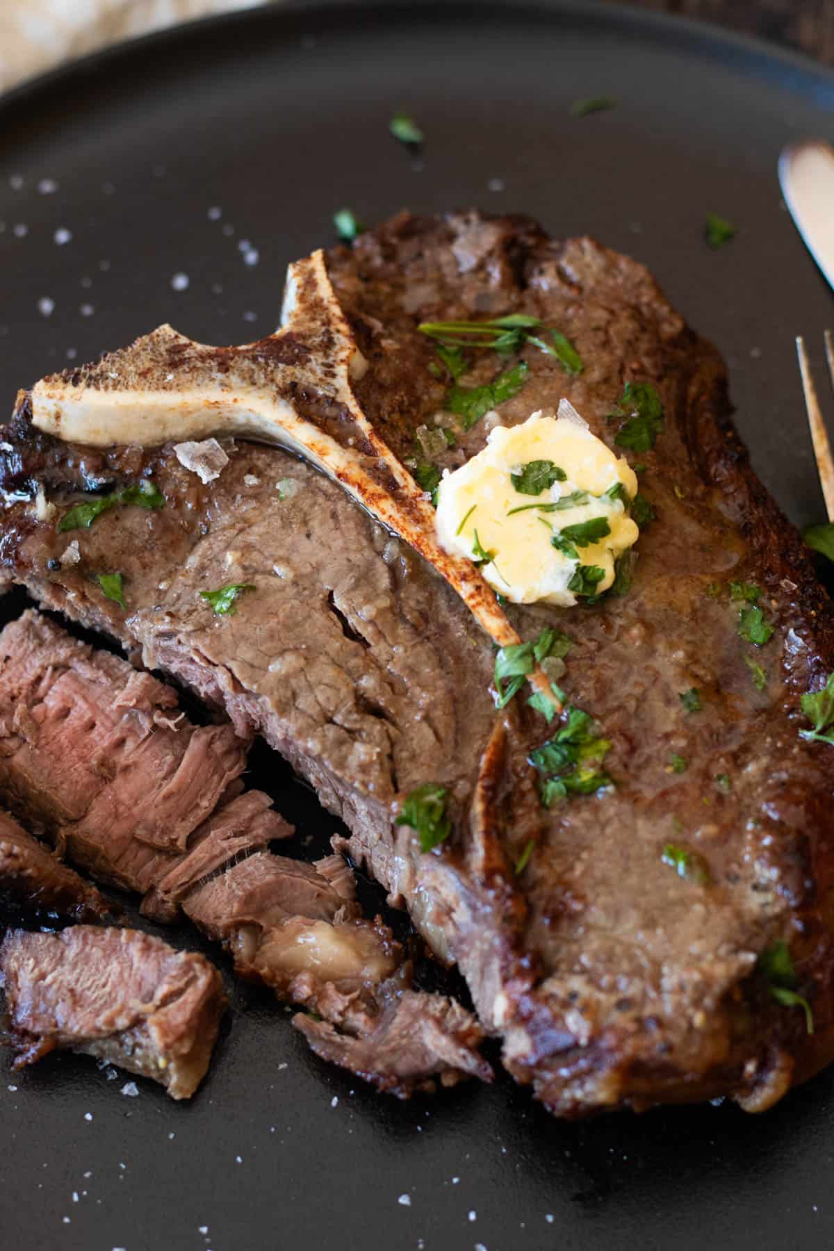 T-bone steak with garlic butter.