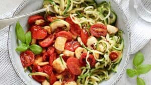 Zucchini noodles with halloumi and cherry tomatoes.