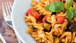 Red pesto pasta with veggies.