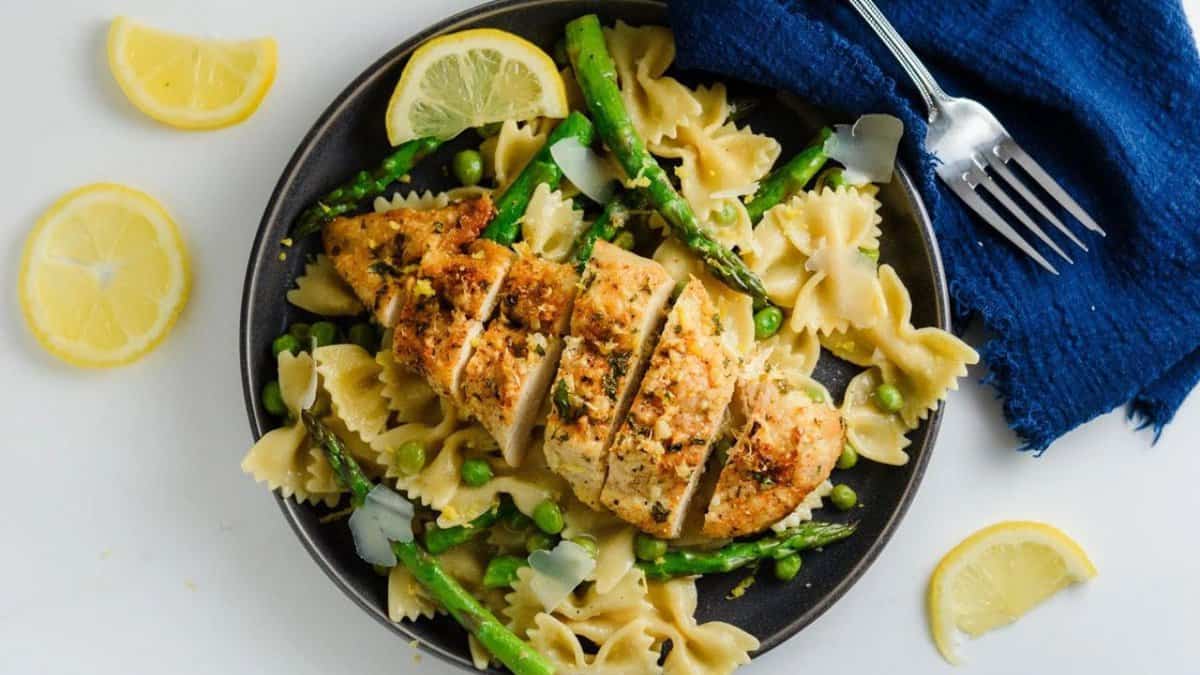 15-Minute Baked Garlic Parmesan Chicken served over pasta.