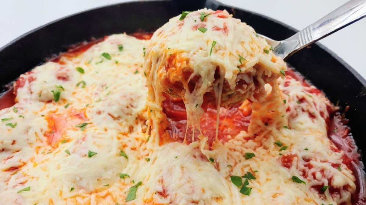 A scoop of Baked Chicken Parmesan Meatballs.