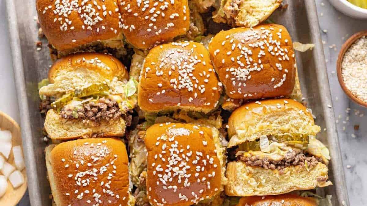 Big Mac cheeseburger sliders on a pan.