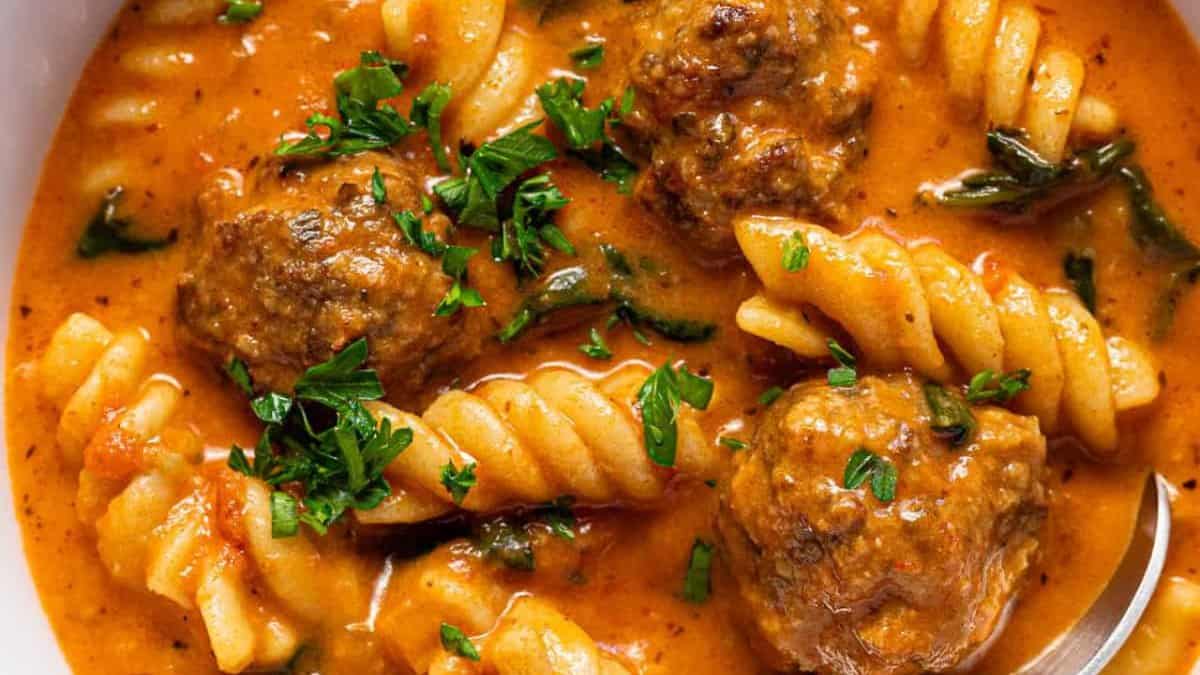 Creamy Italian meatball soup with fresh herbs.