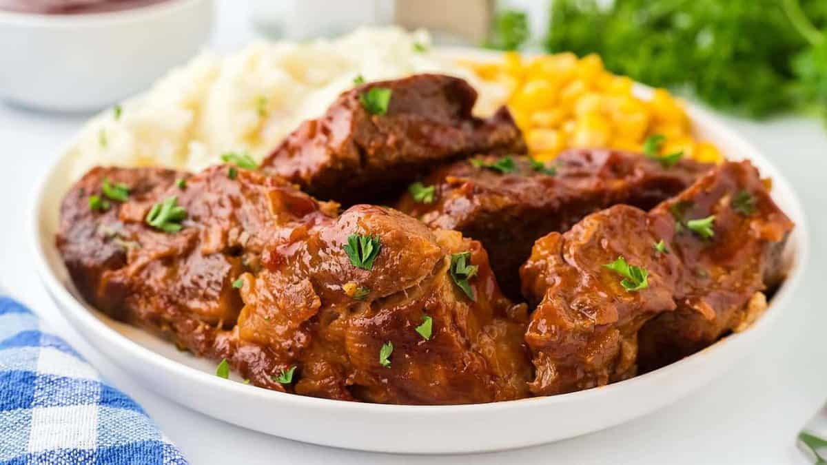 Slow cooker country style ribs served with mashed potatoes.