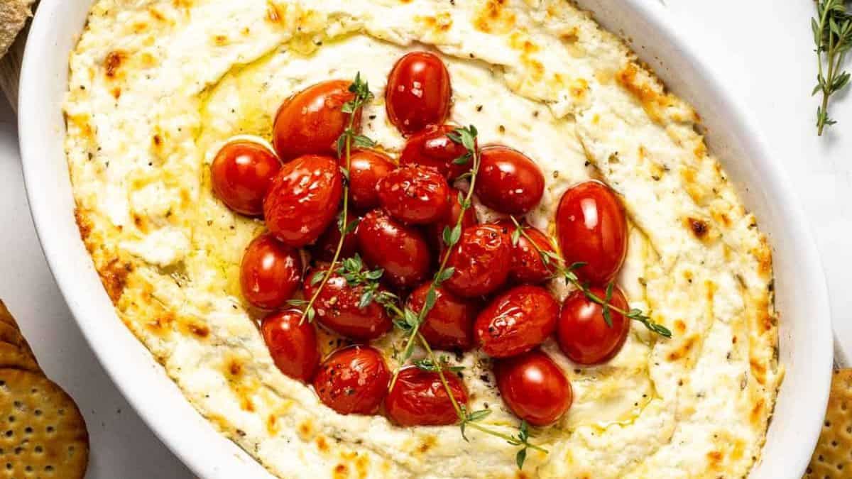 Roasted garlic goat cheese dip with cheery tomatoes.