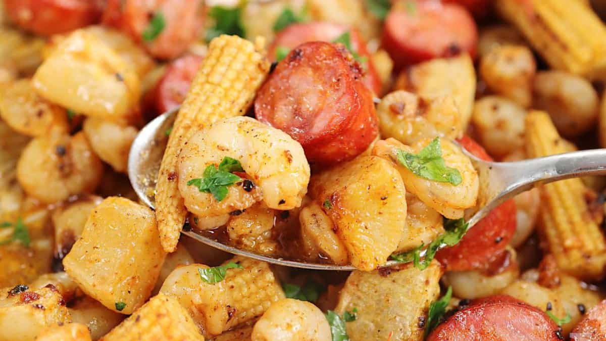 Shrimp boil with sausage and baby corn.