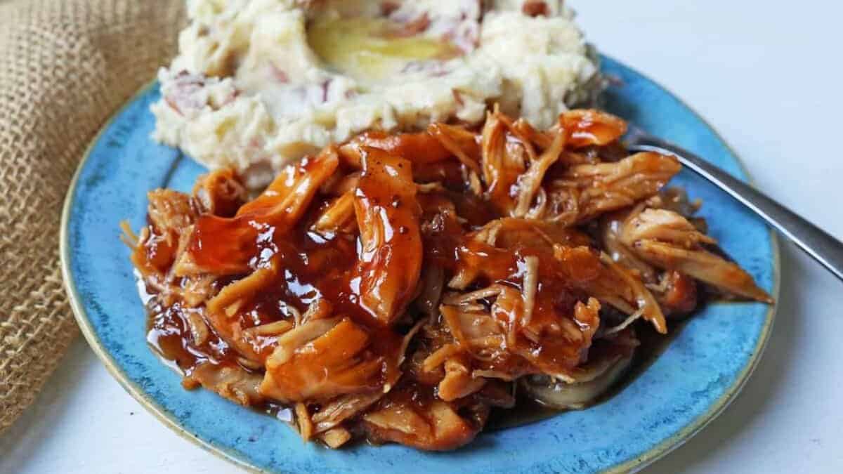 Chicken with sweet barbecue glaze served with mashed potatoes.