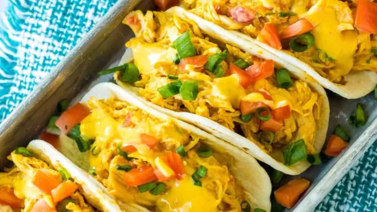 Slow cooker queso chicken tacos.