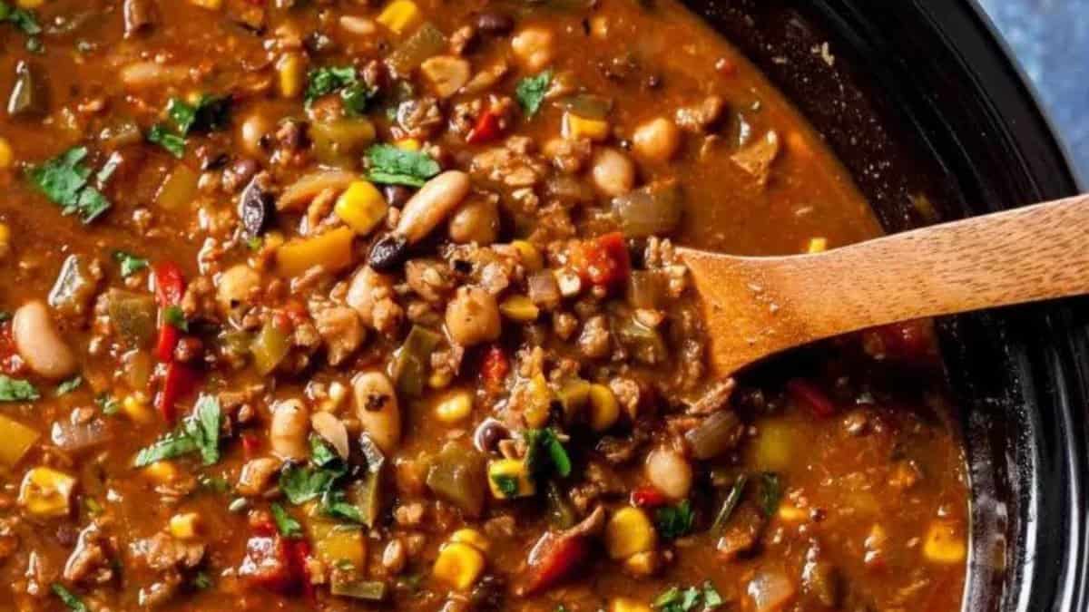 Vegetarian chili and a wooden spoon.